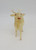 Unknown Vintage Christmas Celluloid 4" Reindeer Toy Figure, a small, cream-colored reindeer with red eyes, red lips, and antlers, suitable for holiday decorations.