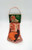 Vintage mesh Christmas stocking filled with kids toys and games. The stocking contains a paper checkers board, plastic chicken, Mystery tricks and puzzles and looks like a mask under the chicken.