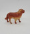 Vintage celluloid toy dog figure that resembles a Saint Bernard but not positive.  The figure is 3.5 inches long and 2.75 inches tall with a orange and tan color scheme.