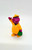 1993 Barney & Friends PVC toy figure of Rainy Day Barney.  The figure stands 2.5 inches tall and features Barney wearing yellow rain gear and carrying his green lunch box.