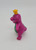 Barney and Friends 1993 King Barney PVC Toy Figure, a pink dinosaur with a yellow crown, smiling and standing upright.