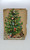 Unknown Vintage Victorian Christmas Tree Scrapbook Scrap and Die Cut, a nostalgic vintage Victorian style Christmas tree with ornaments, figurines, and decorations.