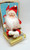 Unknown Vintage Musical Santa Claus Figure Sitting on Present, made in Japan, Christmas holiday decorative collectible.
