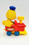 Sesame Street Big Bird wind up toy train by Illco.  Twist the smoke stack to have Big Bird drive the locomotive forward.  You can add more cars to the back to complete the train.