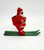 Vintage plastic Santa Claus candy container ornament on green metal skis.  The ornament stands 3.25-inches tall and features a hole on top to hang as an ornament.  The bag is empty to allow placement of candy.