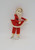 Vintage female Santa ice skater Christmas ornament by Delta Novelty Co. The ornament was made in Japan and stands about 6-inches tall wearing red dress, pants and hat.  The skater also has a white beard.