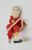 Vintage female Santa ice skater Christmas ornament by Delta Novelty Co. The ornament was made in Japan and stands about 5-inches tall wearing red dress, pants and hat.  The skater also has a white beard.