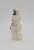 Unknown Vintage Hard Plastic Snowman Figure, side view of a vintage white snowman with a black hat, depicting a classic winter holiday decoration.