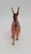 Unknown Vintage Christmas Celluloid Brown Reindeer Toy Figure, front view of a small brown reindeer with white spots and long antlers.