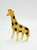 Vintage Celluloid Giraffe toy figure made in Occupied Japan. The giraffe is 3-inches wide and 3.75-inches tall.