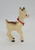 Vintage Rudolph the Red-Nosed Reindeer Christmas ornament made of hard plastic.  Rudolph is wearing a red bow and stands 3.5-inches tall.