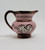 Pavelco Hand Painted 2" Ceramic Creamer with Handle, pink and brown ceramic pitcher featuring mountain and landscape design with trees and birds.