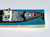 WEN-MAC Vintage AMF Wen-Mac Dolphin Cargo Ship (NO MOTOR), vintage toy ship with detailed deck and red and white accents, in original packaging.