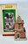Lemax 85384 The Chestnut King, a detailed miniature decorative building resembling a festive, old-fashioned shop with architectural details and snow accents.