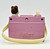 Cabbage Patch Kids Vintage 1984 Cabbage Patch Kids Musical Camera Toy, pink plastic toy resembling a vintage camera with a doll head on top and a beige handle, made in Macau.