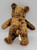Genich Intl 9" Brown Teddy Bear, soft plush toy viewed from the back showing fluffy fur and small tail.