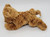 A Mart Corp Stuffed Brown Bear, plush teddy bear toy with soft, curly fur lying on a plain white surface.