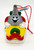 Hershey's 1996 Hershey's Kiss on Snowmobile PVC Ornament, holiday decoration featuring a joyful Hershey's Kiss character riding a snowmobile with a tag reading 'Hershey's' and the year 1996.