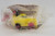 Wendy's Kids' Meal Toy 1995 Techno Tows - Shovel Tow, yellow toy tow truck with black and pink details in plastic packaging.