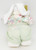 Unbranded Easter Bunny 8" Table Top Decor, plush Easter bunny with long white ears, wearing pastel-colored clothing and a light green backpack, standing upright for spring holiday decoration.
