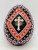 Unknown Pysanka Easter Egg with Christian Cross on it, intricately painted with geometric patterns and vibrant colors.