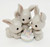 Enesco Precious Moments 1994 'Another Year and More Grey Hares' figurine, adorable grey hares celebrating Easter with a pastel-colored cake.