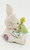 Unknown White With Patchwork Bunny Reading Book 2.25'' Resin Figurine, decorative bunny figurine with a patchwork design, holding a blue book and a yellow chick on its back, featuring pastel colors and textured surface.