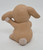 Unbranded Ceramic Seated Brown Bunny Scratching Ear Figurine, ceramic bunny figurine with a textured brown finish in a seated position scratching its ear against a plain white background.