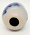 Unknown Grey with Blue Flowers Ceramic 3" Egg, decorative ceramic egg with a floral design and a hole at the bottom.