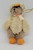 Bearington Collection - Bear Wearing Duck Costume Ornament, plush teddy bear dressed in a soft, fluffy duck outfit with a tiny beak hat and orange feet.