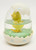 Enesco 1989 Easter Chick in Egg Snowglobe, decorative egg-shaped snow globe featuring a yellow chick inside with an egg shell top and a green grassy base.