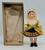 Unknown Vintage Dolls of the World 7" Czechoslovakia Plastic Doll with Dress, vintage collectible doll standing next to a box with tissue paper