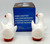King Importing, Inc. Vintage Hand Crafted Fine Earthenware Hugging Duck Salt & Pepper Shakers, white ceramic duck-shaped salt and pepper shakers with orange beaks and feet positioned in front of a blue box.