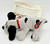 TONKA Vintage Tonka Pound Puppy 7-inch Grey with Brown Spots Dog, soft plush toy with embroidered cartoon face and red collar.