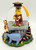 Disney's Winnie the Pooh Graduation Class of 2000 Musical Snow Globe, featuring Winnie the Pooh dressed in a graduation gown holding a diploma, with Tigger and Eeyore surrounding the base, decorated with colorful flowers and books.