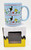 Peanuts 2022 Snoopy and Woodstock Winter Themed 12 oz. Coffee Mug, light blue mug decorated with Snoopy wearing a Christmas hat and Woodstock, with Christmas trees and snowflakes, placed on its original packaging box.