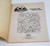 The Land Before Time Coloring and Activity Book (Spike) - 1997, black and white coloring page featuring characters from The Land Before Time series surrounded by leaves and flowers.