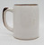 Unknown Vintage Niagara Falls Rainbow 16 ounce Pottery Mug Beer Stein, plain beige mug with brown accents on the rim and handle, showing slight scratches and vintage wear.