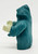 TONKA Tonka 1987 Super Naturals Rags Evil Ghostling Action Figure, side view of a blue haunted ghost figure with a hood and holding a piece of bone.