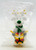 Applause Christmas White Reindeer Playing Drum PVC Toy Figure, festive holiday ornament featuring a cheerful white reindeer with antlers, a green nose, and colorful drum, inside clear plastic packaging.
