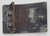 Smith and Wesson Vintage Smith and Wesson World's Finest Handgun Brass Belt Buckle, an old, rustic metal belt buckle with a tarnished surface and a metal clasp.
