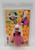 Nelsonic 1994 The Flintstones Dino Plush Watch, plush toy shaped like Dino the dinosaur from The Flintstones, encased in clear plastic packaging with colorful cartoon graphics.