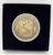 AHL Hershey Bears 2002 Hershey Park Arena 64 Years Commemorative Coin, gold-colored coin with bear hockey player design and engraved text in a black display case.