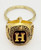 AHL Hershey Bears 1997 Calder Cup Championship Ring Keychain, gold-colored ring with a shield-shaped emblem displaying a large 'H' and engraved team and championship details.