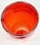 Coca-Cola American Idol Red Plastic Cup, photographed from above showing the inside of the red plastic cup with Coca-Cola logo reflected on the surface.