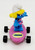 Smurfs Hardees Kids Meal Toy 1996 Smurfs - Smurfette on Purple Skateboard, toy figurine of Smurfette with blonde hair and white hat, standing on pink skateboard with wheels.