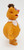 Muppet's Jim Henson's The Muppets 1978 Fozzie Bear Toy Figure, side view of an orange plush toy with a white polka-dotted scarf, wearing a brown hat, with detailed textured fur and colorful facial features.