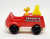 AVIVA Toy Co 1965 Peanuts Snoopy's Rescue Squad Fire Truck With Woodstock, vintage red toy fire truck with Snoopy and Woodstock figurines, collectible children's toy from 1965.