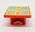 Fisher-Price Original Little People #994 Play Family Camper - Hotdogs Dinner Picnic Table, colorful children's plastic picnic table with a yellow top decorated with images of hotdogs, ketchup, mustard, and plates, red legs, and a white background.