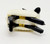 Fisher-Price Original Little People Sheep Woolie the Sheep, small plastic toy sheep in black and white colors stacked together on a plain white background.
